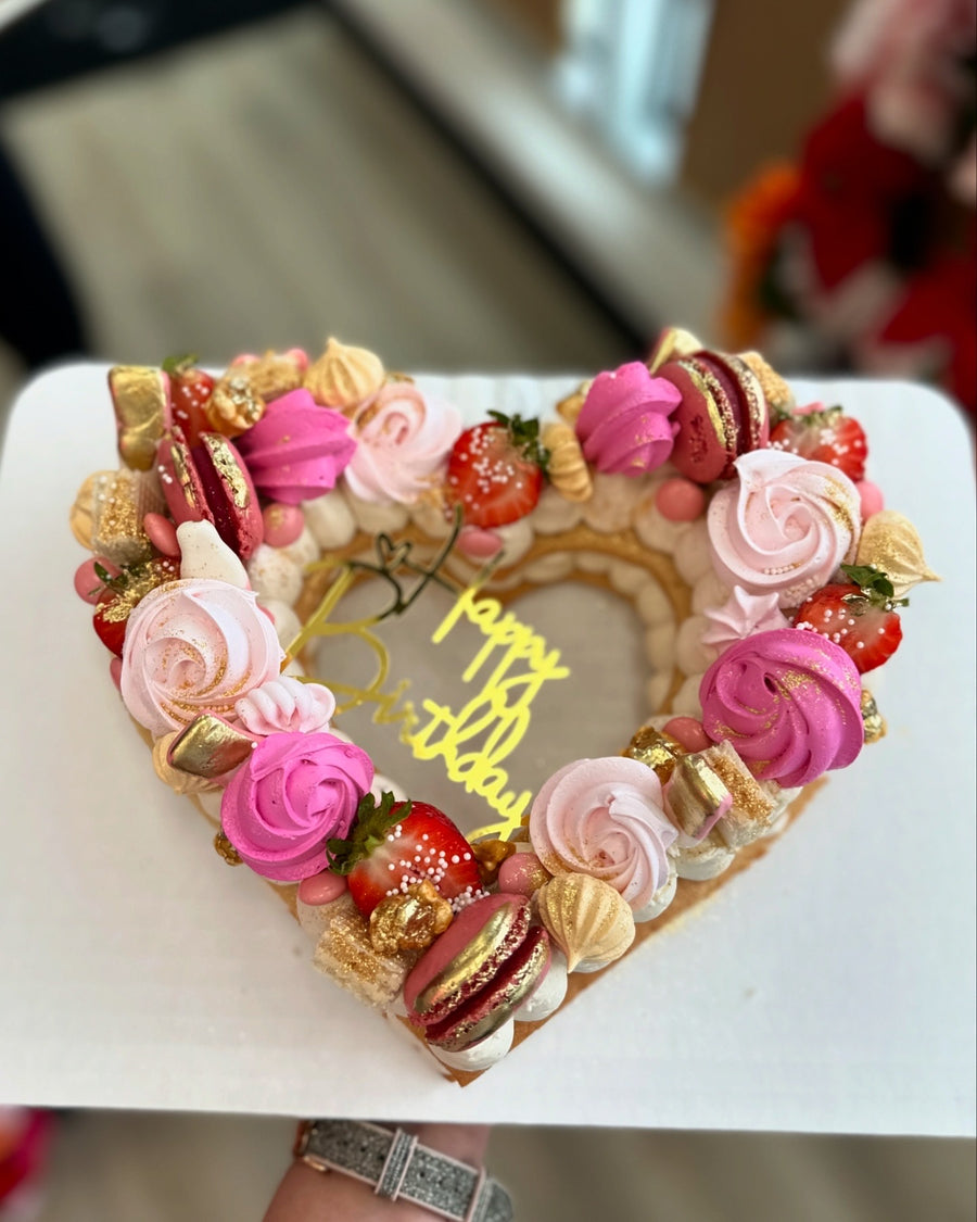 Heart shaped Dream Tart with strawberries, pink meringues and a happy birthday topper